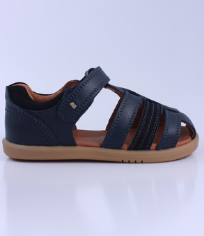 Roam showing the navy closed‑toe upper, side openings and ankle strap.
