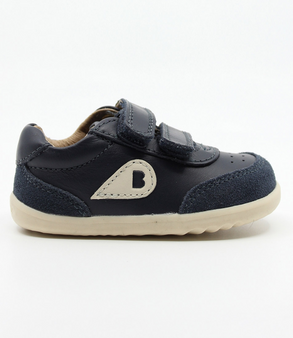Champ showing the navy leather upper, white sole and double straps.