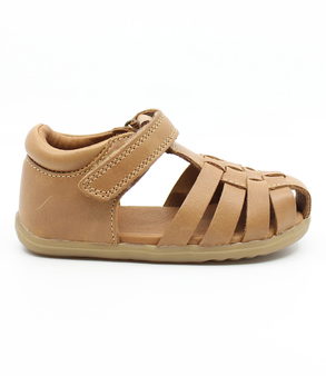 Caramel unisex leather sandal with closed heel, woven straps and hook-and-loop fastening.