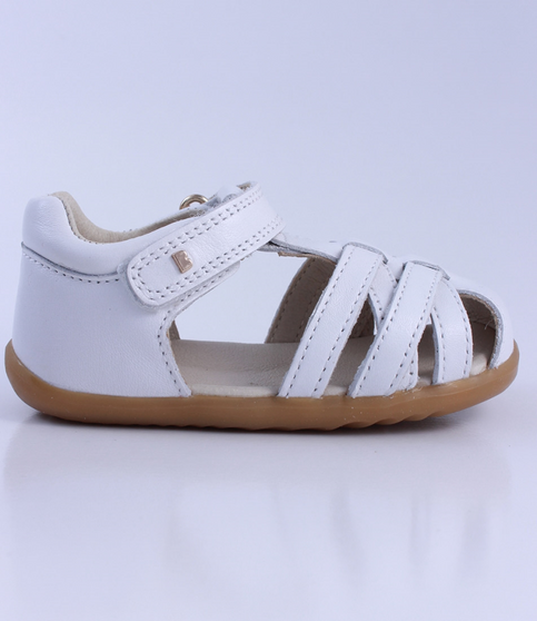 Cross Jump showing the white leather upper, cut‑outs and ankle strap.