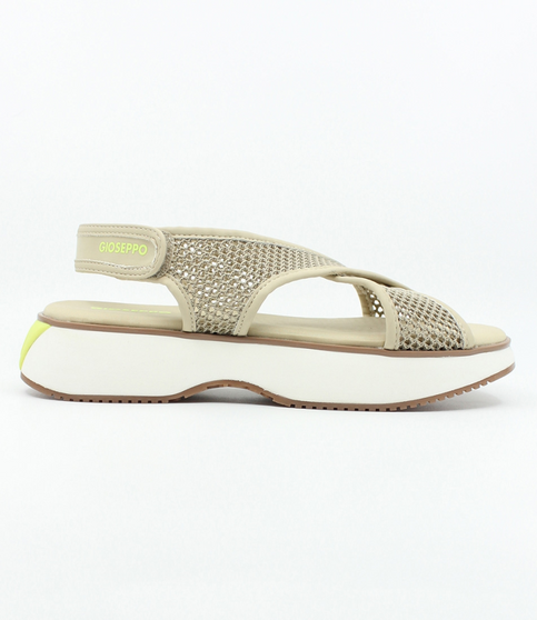 Beige women’s mesh sporty sandal with crisscross straps and chunky platform sole.