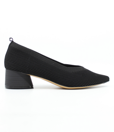 Black women’s ribbed flyknit low‑heel pump with pointed toe and cushioned footbed.