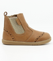 Side view of the Billie showing the caramel leather upper, brogue details and inside zip.