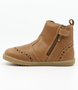 Side view of the Billie showing the caramel leather upper, brogue details and inside zip.