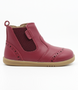 Side view of the Billie showing the red leather upper, brogue details and inside zip.