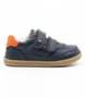 Side view of the Hunter showing the navy leather upper, orange detailing and double hook‑and‑loop straps.