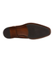 Side view of the KICK cognac Chelsea boot showing burnished upper and elastic gusset.