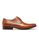 Side view of the KEEN tan Derby showing burnished upper and plain vamp.
