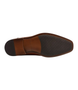 Side view of the KEEN tan Derby showing burnished upper and plain vamp.