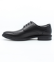 Side view of the WAVE black lace‑up showing smooth upper and rounded toe.