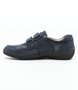 Side view of the HESNA 01 showing the navy leather upper, rounded toe and low-profile sole.