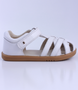 Cross Jump showing the white leather upper, cut‑outs and ankle strap.