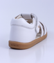 Cross Jump showing the white leather upper, cut‑outs and ankle strap.