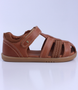 Roam showing the caramel closed‑toe upper, side cut‑outs and ankle strap.
