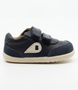 Champ showing the navy leather upper, white sole and double straps.
