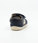 Champ showing the navy leather upper, white sole and double straps.