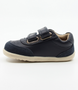 Champ showing the navy leather upper, white sole and double straps.