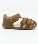 Cross Jump showing the caramel leather upper, cut‑outs and ankle strap.