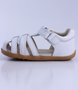 Cross Jump showing the white leather upper, cut‑outs and ankle strap.