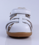 Cross Jump showing the white leather upper, cut‑outs and ankle strap.