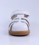 Cross Jump showing the white leather upper, cut‑outs and ankle strap.
