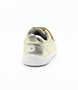 Grass Court II showing the pale‑gold leather upper, white sole and double straps.