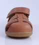 Roam showing the caramel closed‑toe upper, side openings and ankle strap.