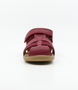 Roam showing the cherry leather upper, side openings and ankle strap.