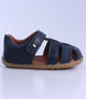 Roam showing the navy closed‑toe upper, side cut‑outs and ankle strap.