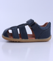 Roam showing the navy closed‑toe upper, side cut‑outs and ankle strap.
