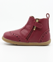 Billie showing the red leather upper, brogue details and inside zip.