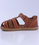 Roam showing the caramel closed‑toe upper, side openings and ankle strap.