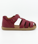 Roam showing the cherry leather upper, side cut‑outs and ankle strap.