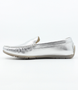 Metallic-sheen moccasin slip-on with penny trim and raised heel, silver finish.
