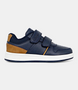 Navy kids sneaker with dual self‑fastening straps and contoured footbed