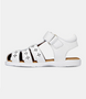 White leather girls’ sandal with caged‑toe design and flower cut‑outs