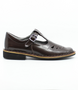 Brown leather girls T‑bar school shoe with perforated vamp and buckle strap.