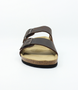 Mens brown leather two strap sandal with adjustable buckles, contoured footbed and cork midsole.