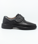 Mens black leather shoe with wide hook and loop strap, stitched detailing and flexible comfort sole.