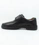 Mens black leather shoe with wide hook and loop strap, stitched detailing and flexible comfort sole.