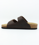 Brown womens nubuck slide sandal with adjustable buckle straps and contoured cork footbed.