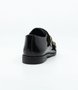 Black boys leather double monk strap dress shoe with gold buckles and cushioned sole.