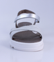 White Silver girls leather and man made sandal with adjustable strap and cushioned sole.