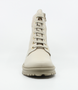 Beige girls leather ankle boot with quilted collar, lace‑up front, side zip and tread sole.