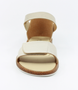 Gold girls leather sandal with hook‑and‑loop straps and cork‑textured sole.