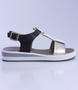 Black Gold White girls leather sandal with buckle and platform sole.