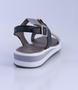 Black Gold White girls leather sandal with buckle and platform sole.