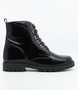 Black girls patent leather ankle boot with lace‑up front, side zip and tread sole.
