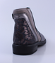 Silver girls leather and nubuck ankle boot with patterned heel, side zip and low heel.