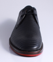 Preto men’s leather dress shoe with stitched stripe texture, two‑eyelet lace‑up and contrast sole.